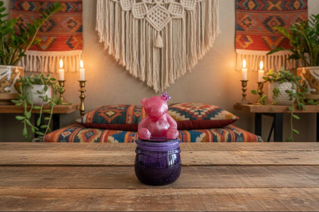 Add a touch of whimsy to your home with our Knickknack - Resin Jar. Featuring a playful bear screw on lid, this jar is perfect for storing small items. Measuring 2.75 x 2.75 inches with a height of 5 inches and a weight of 7.8 oz, it's both functional and fun!
