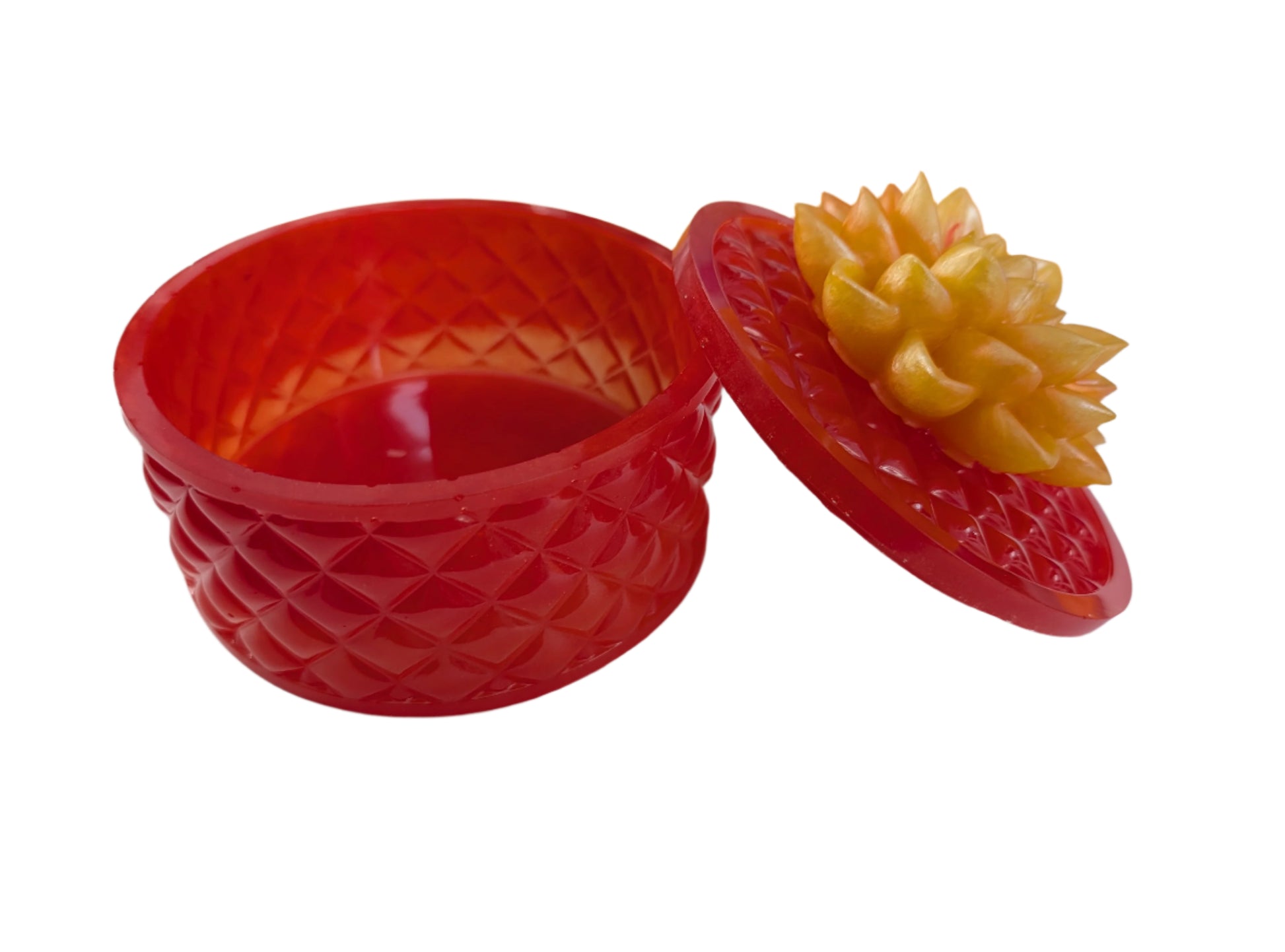 Keep your tiniest treasures safe in our round trinket box. With a charming resin design and a beautiful flower lid, it adds a playful touch to any space. At approximately 5 x 5 in, 4.25 in height, and weighing 11.7 oz, it's perfect for your precious items.