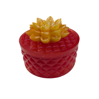 Keep your tiniest treasures safe in our round trinket box. With a charming resin design and a beautiful flower lid, it adds a playful touch to any space. At approximately 5 x 5 in, 4.25 in height, and weighing 11.7 oz, it's perfect for your precious items.