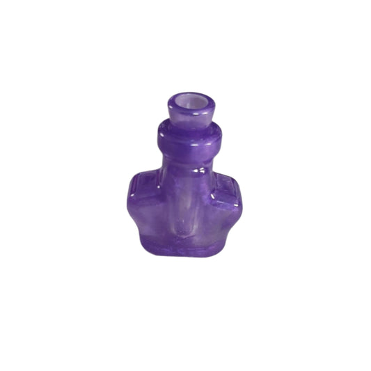 Indulge in a touch of magic with this small resin star potion bottle trinket. Its intricately designed star shape and compact size make it a unique addition to any collection. Use it to store precious memories or as a decorative piece. Perfect for lovers of all things whimsical and enchanting!