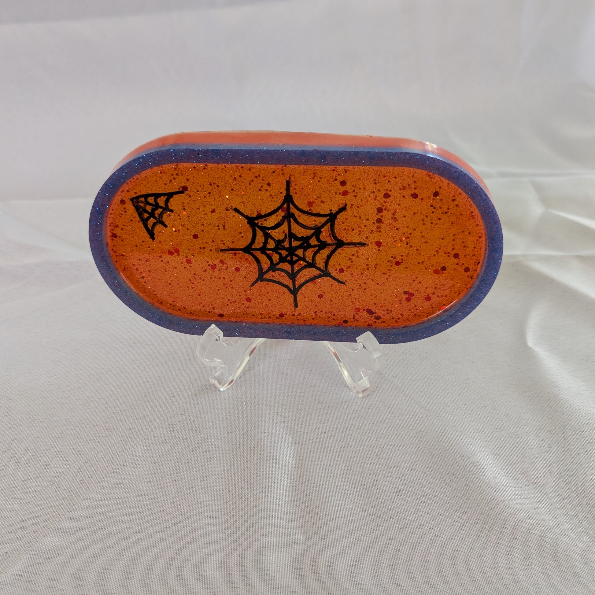 This Knickknack trinket dish not only adds a fun touch to any space with its super hero theme, but also serves as a functional and stylish storage option for small items. Made of durable resin, it is designed to keep jewelry, change, and other trinkets organized and easily accessible.