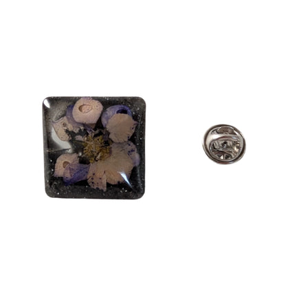 Add a touch of whimsy to any outfit with our 3D dried flower in resin pin. The stunning silver butterfly clutch ensures secure and easy attachment. Let this pin be your new go-to accessory for an elevated and playful look!