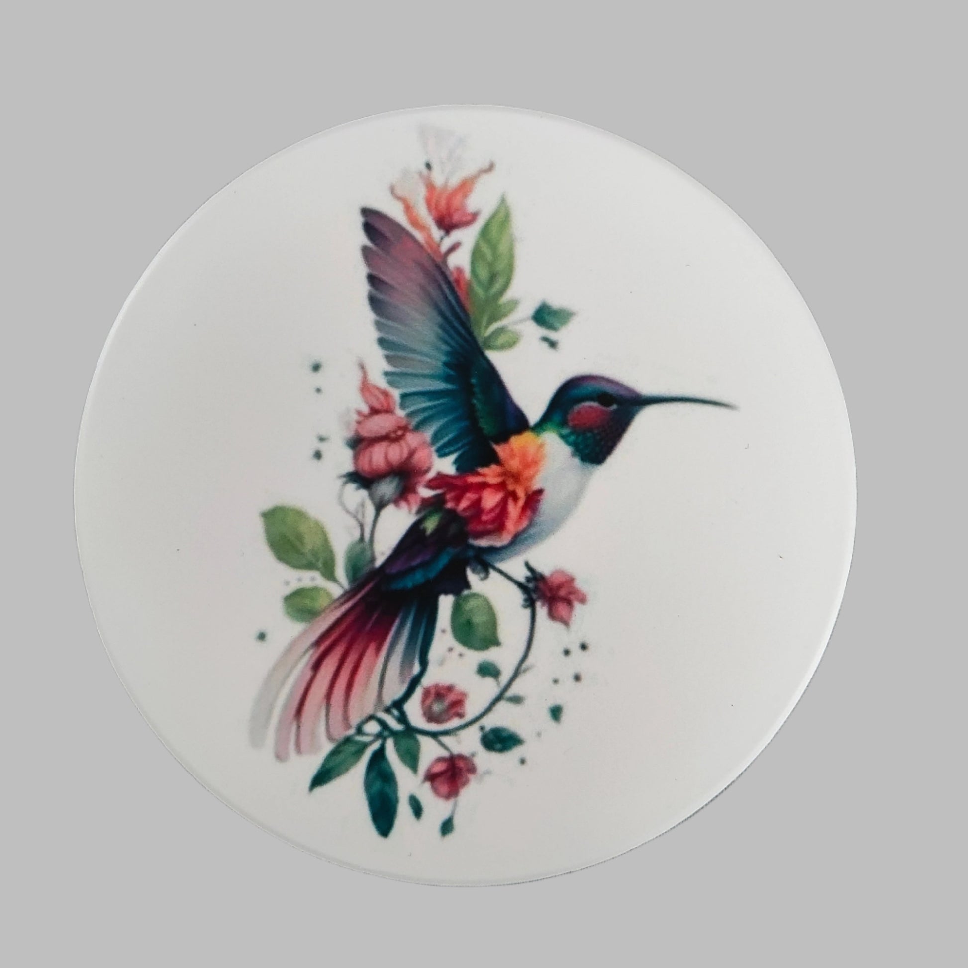 Enhance your home decor with our round ceramic coaster featuring a beautiful hummingbird design. Made with durable materials, this coaster provides protection for your furniture while adding a touch of nature to your space. Expertly crafted for long-lasting use, it's the perfect addition to any household.
