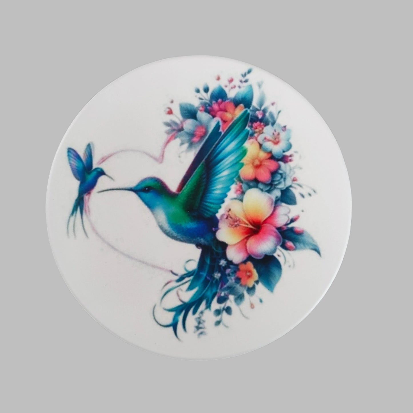 Enhance your home decor with our round ceramic coaster featuring a beautiful hummingbird design. Made with durable materials, this coaster provides protection for your furniture while adding a touch of nature to your space. Expertly crafted for long-lasting use, it's the perfect addition to any household.