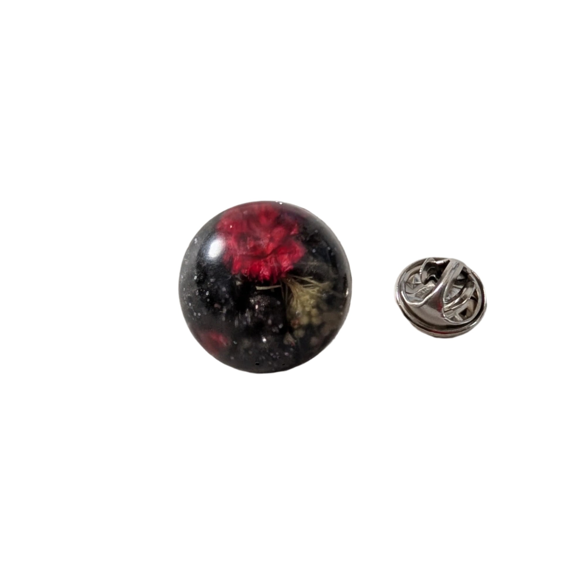 Add a touch of nature to your outfit with our Pin - 3D dried flower resin pin. The intricate design and 3D effect will surely catch everyone's eye. With the sturdy silver butterfly clutch, your pin will stay securely in place. Elevate your style with this unique and beautiful accessory.