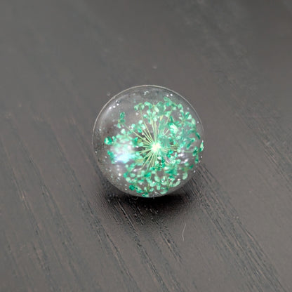 Add a touch of nature to your outfit with our Pin - 3D dried flower resin pin. The intricate design and 3D effect will surely catch everyone's eye. With the sturdy silver butterfly clutch, your pin will stay securely in place. Elevate your style with this unique and beautiful accessory.