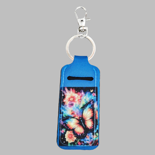 This keychain doubles as a convenient lipstick holder, featuring a colorful, sublimated butterfly design. Keep your favorite lipstick easily accessible while on the go.