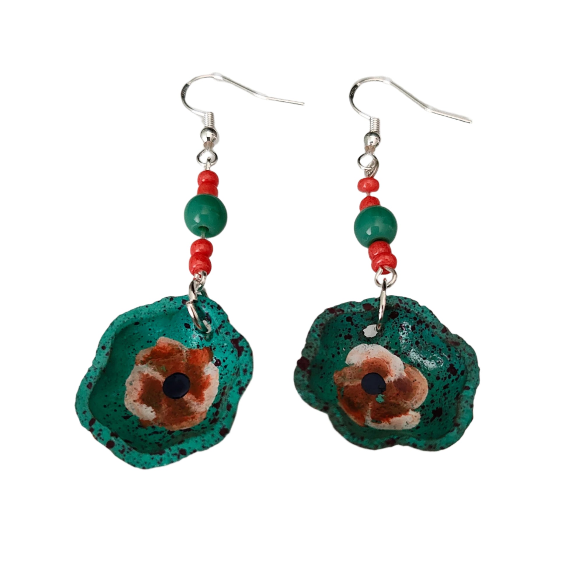 Add a taste of Mexico to your wardrobe with our Earrings! Unique ceramic plates adorned with crystal and seed beads dangle from sleek silver hooks. At 2.5 inches long and weighing only 0.13 oz, these earrings are a lightweight and stylish addition to any outfit.