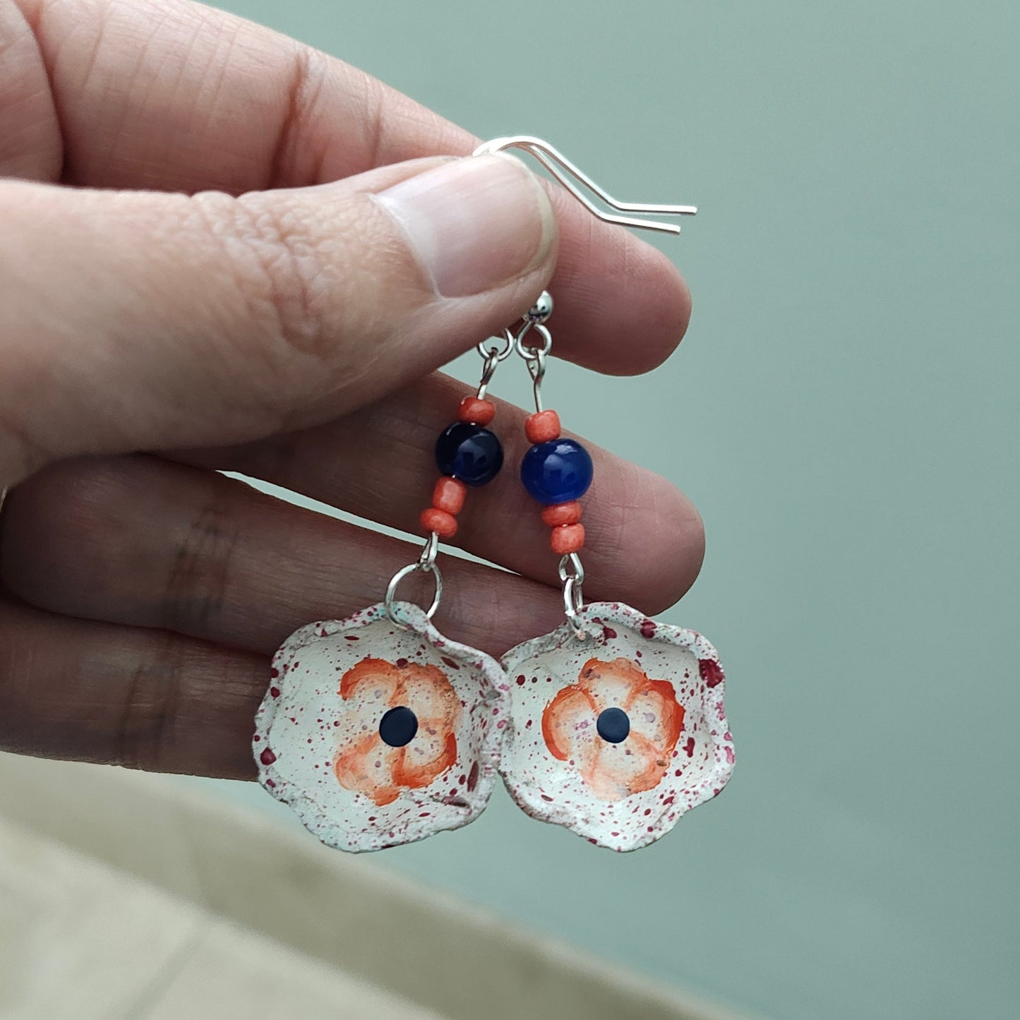 Add a taste of Mexico to your wardrobe with our Earrings! Unique ceramic plates adorned with crystal and seed beads dangle from sleek silver hooks. At 2.5 inches long and weighing only 0.13 oz, these earrings are a lightweight and stylish addition to any outfit.