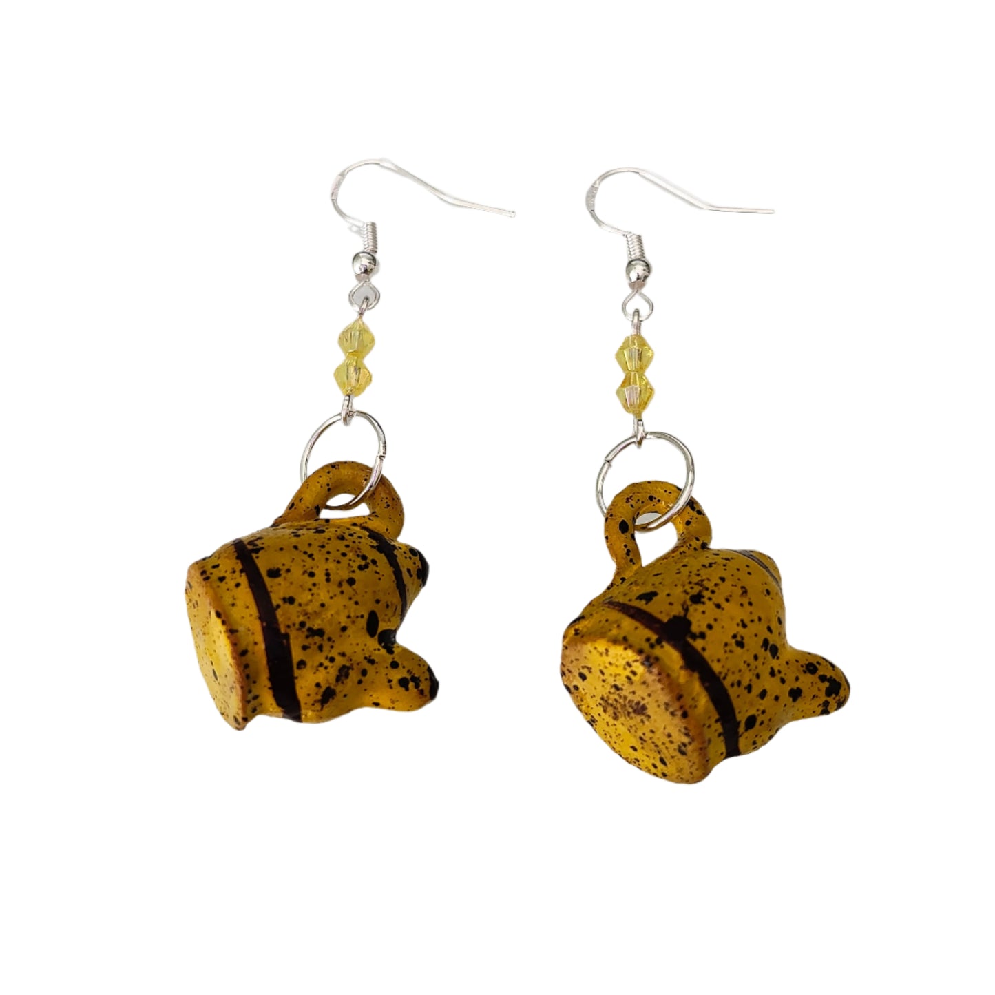 Add a playful and quirky touch to your jewelry collection with our Ceramic Kettle Earrings! These unique earrings feature colorful beads on a silver hook, adding a touch of whimsy to any outfit. Measuring at 2.25 inches in length and weighing just 0.19 ounces, they're the perfect statement piece for any occasion.