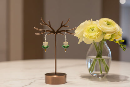 Delicate crystal and seed beads form an enchanting flower design, suspended from hypoallergenic 925 sterling silver hooks. These lightweight earrings measure just 1.5 inches, making them perfect for everyday elegance or layering with other pieces. At only 0.1 oz, they're comfortable enough to wear all day without fatigue. The shimmering bead work catches light beautifully, adding a touch of sparkle and sophistication to any outfit. Ideal for those who appreciate handcrafted jewelry with timeless appeal.