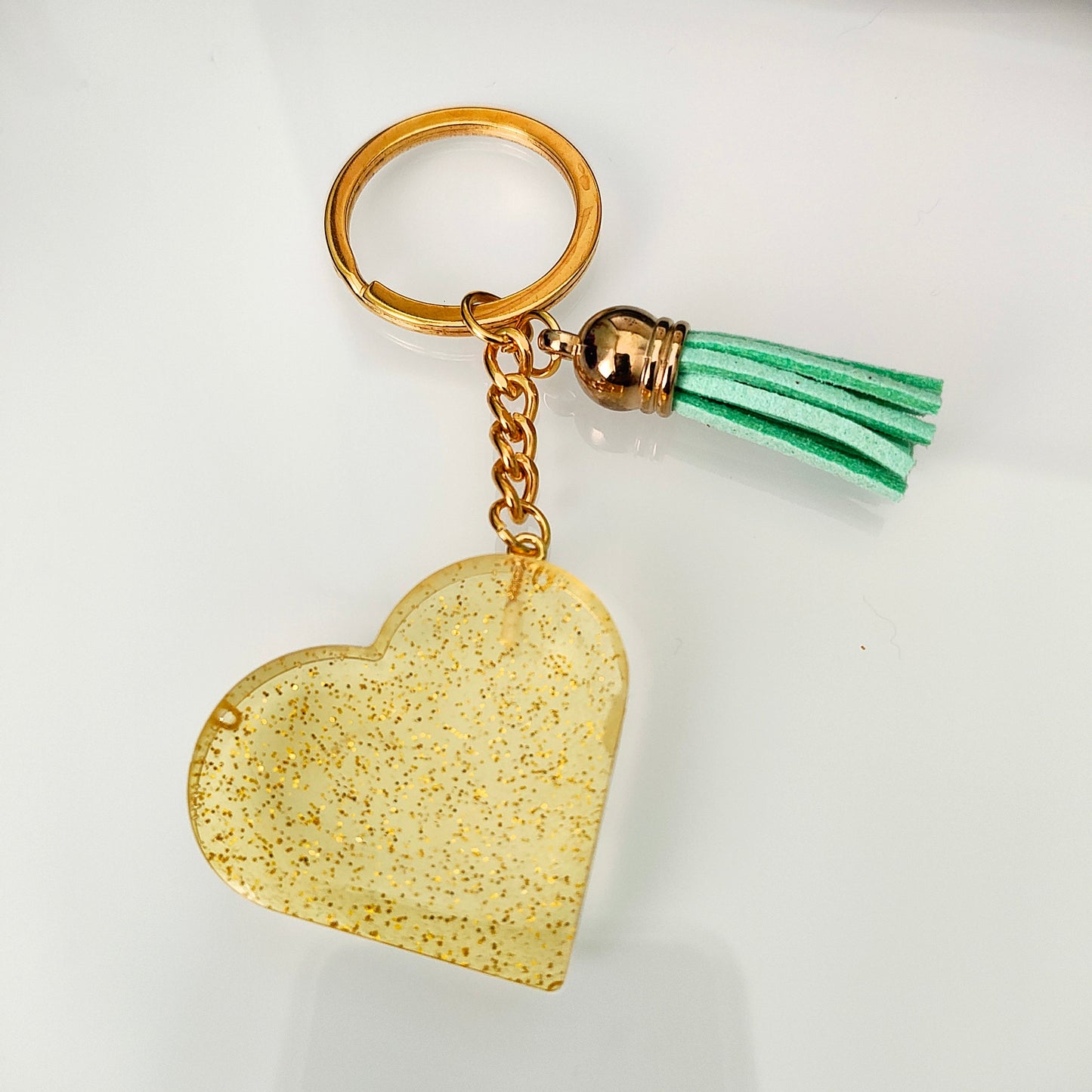 Show your heart is in the right place with this one-of-a-kind keychain! Its resin heart design is as unique as it is eye-catching – no two are alike. Plus, it's lightweight, making it perfect for carrying everywhere you go. Get your keychain on!