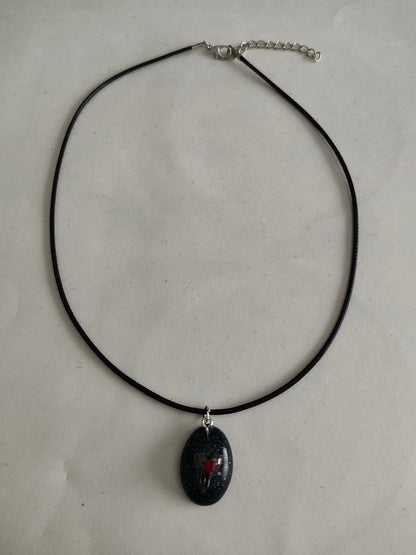 Necklace - 17.5 inches black waxed cord with resin & silver charm pendant