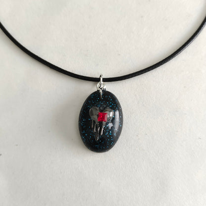 Necklace - 17.5 inches black waxed cord with resin & silver charm pendant