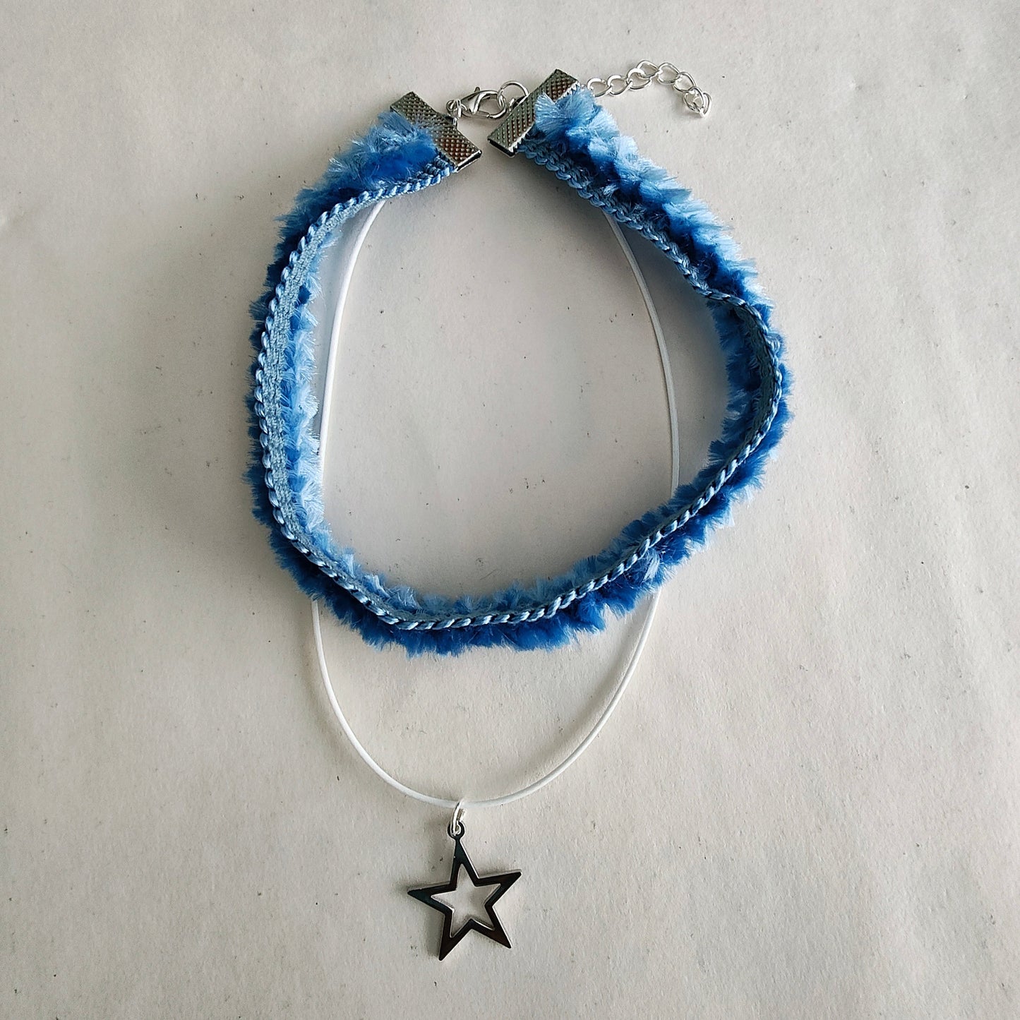 Necklace - Choker blue lace ribbon with one polyester strand and a silver star charm