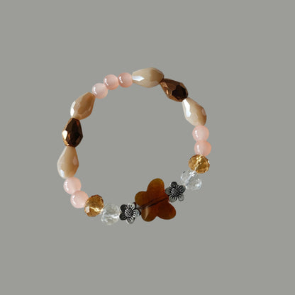 Bracelet - Elastic Crystal butterfly bead with brown, white, & pink beads and flower metal spacer beads