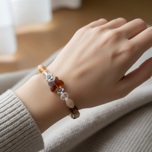 Bracelet - Elastic Crystal butterfly bead with brown, white, & pink beads and flower metal spacer beads