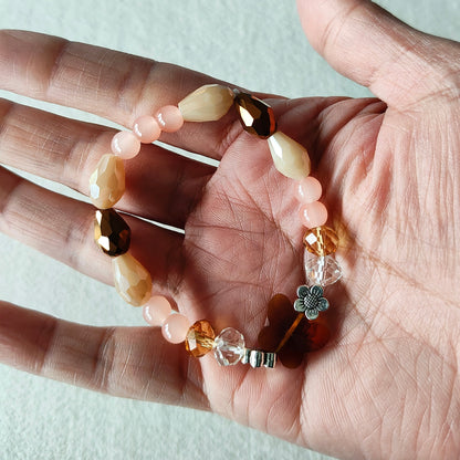 Bracelet - Elastic Crystal butterfly bead with brown, white, & pink beads and flower metal spacer beads