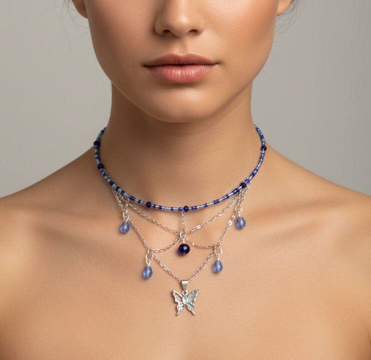 Capture the magic of transformation with this enchanting butterfly memory wire choker. Delicate seed and crystal beads frame a stunning silver butterfly charm that becomes the focal point of this graceful design. The hassle-free memory wire construction fits perfectly every time—no clasps required—while the featherlight 0.38 oz weight makes it ideal for layering or wearing solo. 