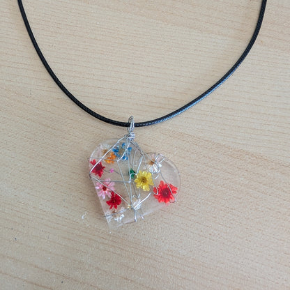 Necklace - 17.5 inches clear resin with dried flowers heart on black cord