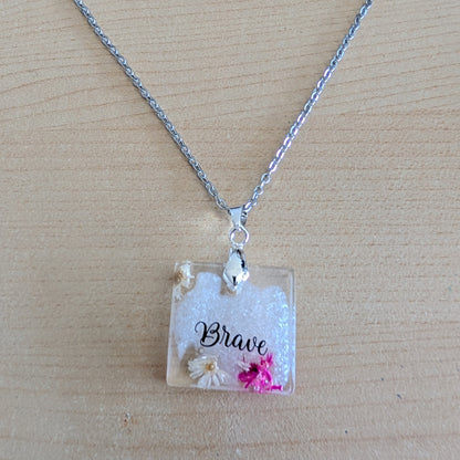 Necklace - 21 inches stainless steel cable link chain with a resin with flowers square pendant