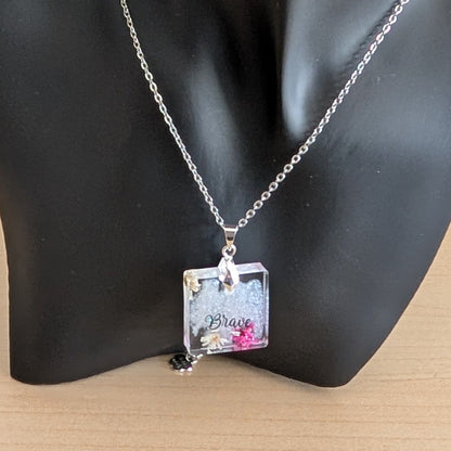 Necklace - 21 inches stainless steel cable link chain with a resin with flowers square pendant