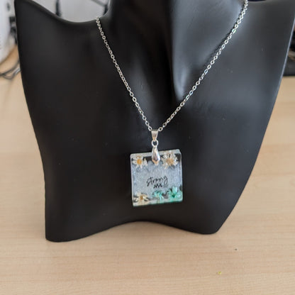 Necklace - 21 inches stainless steel cable link chain with a resin with flowers square pendant