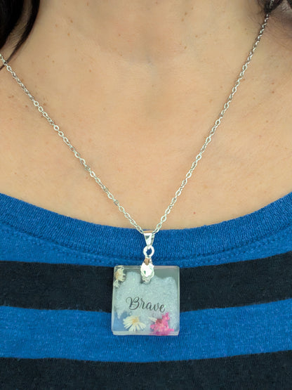 Necklace - 21 inches stainless steel cable link chain with a resin with flowers square pendant