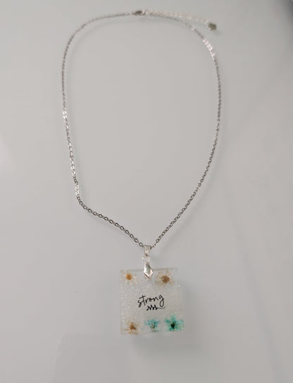 Necklace - 21 inches stainless steel cable link chain with a resin with flowers square pendant