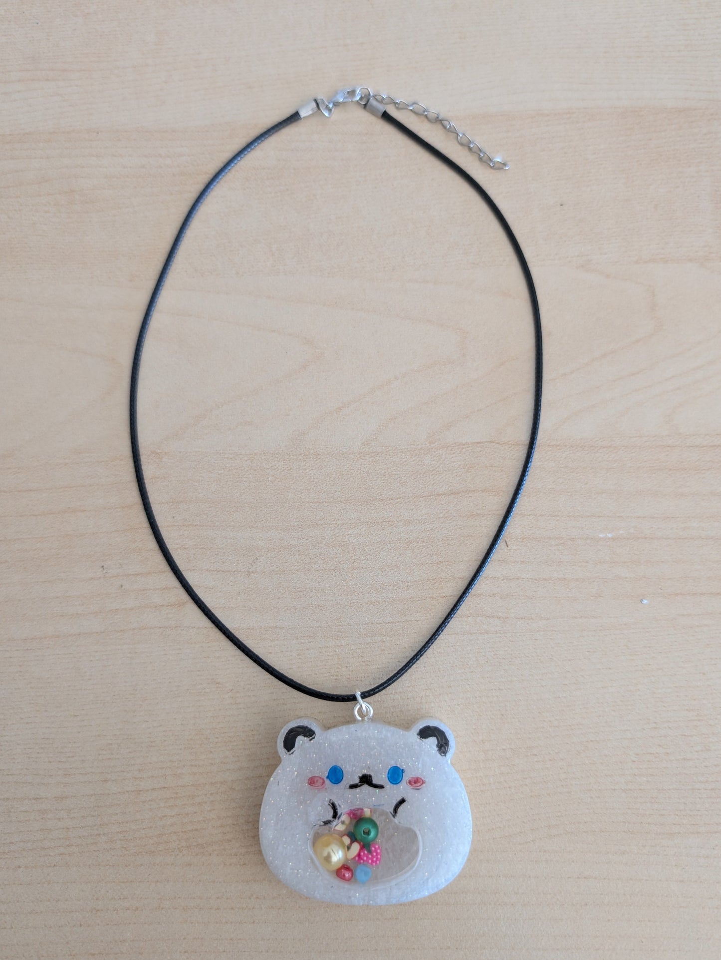 Necklace - 17.5 inches resin shaker bear on black leather cord with clasp