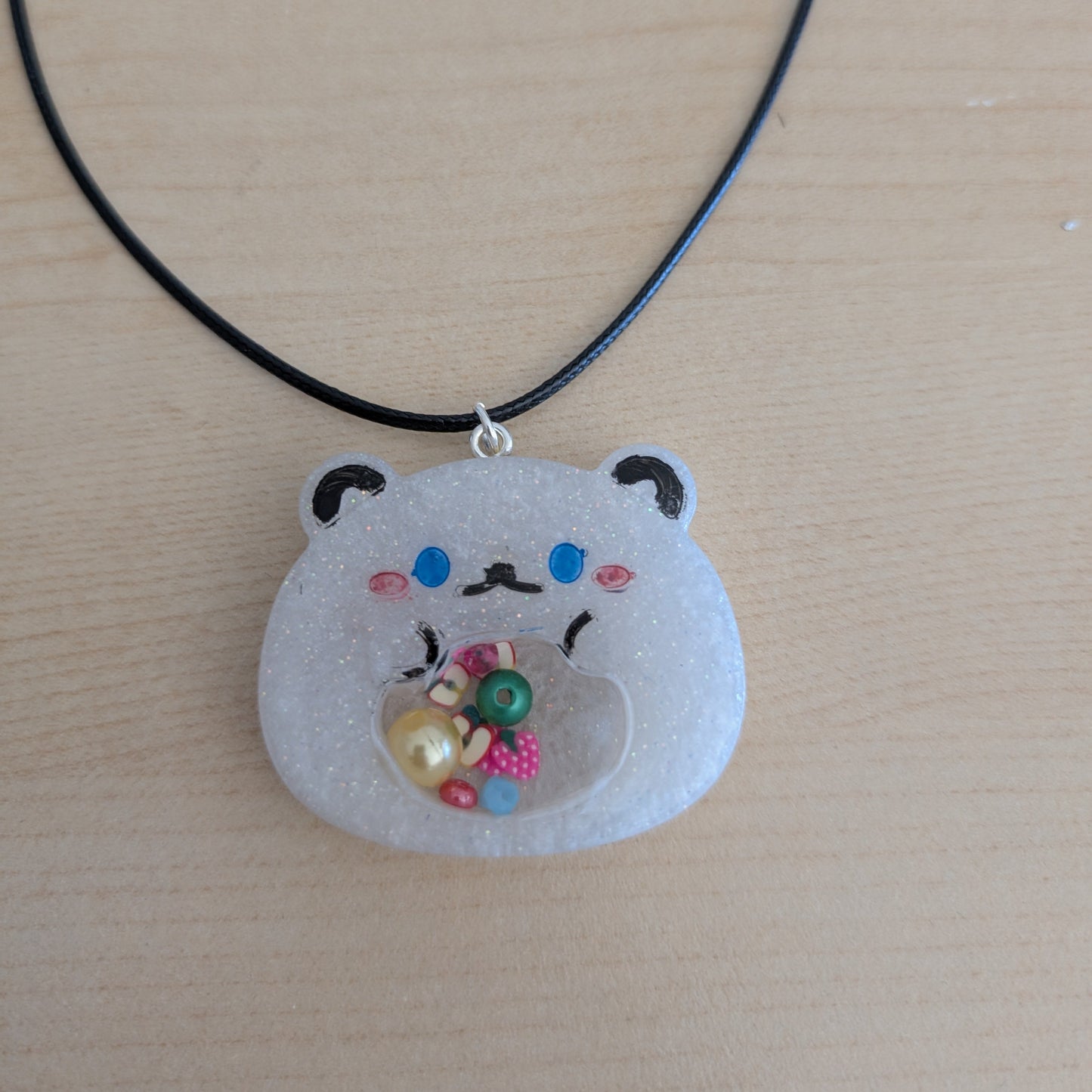 Necklace - 17.5 inches resin shaker bear on black leather cord with clasp