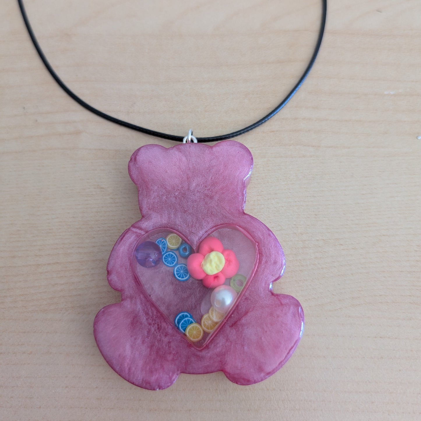 Necklace - 17.5 inches resin shaker bear on black leather cord with clasp