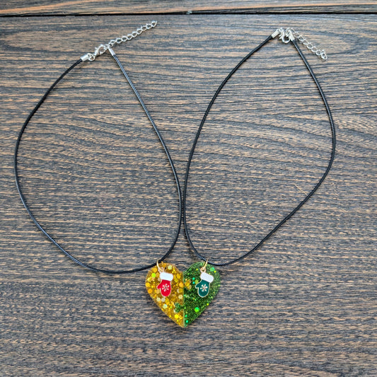 Necklace - 17.5 inches black waxed cord with two resin half hearts and a Christmas charm