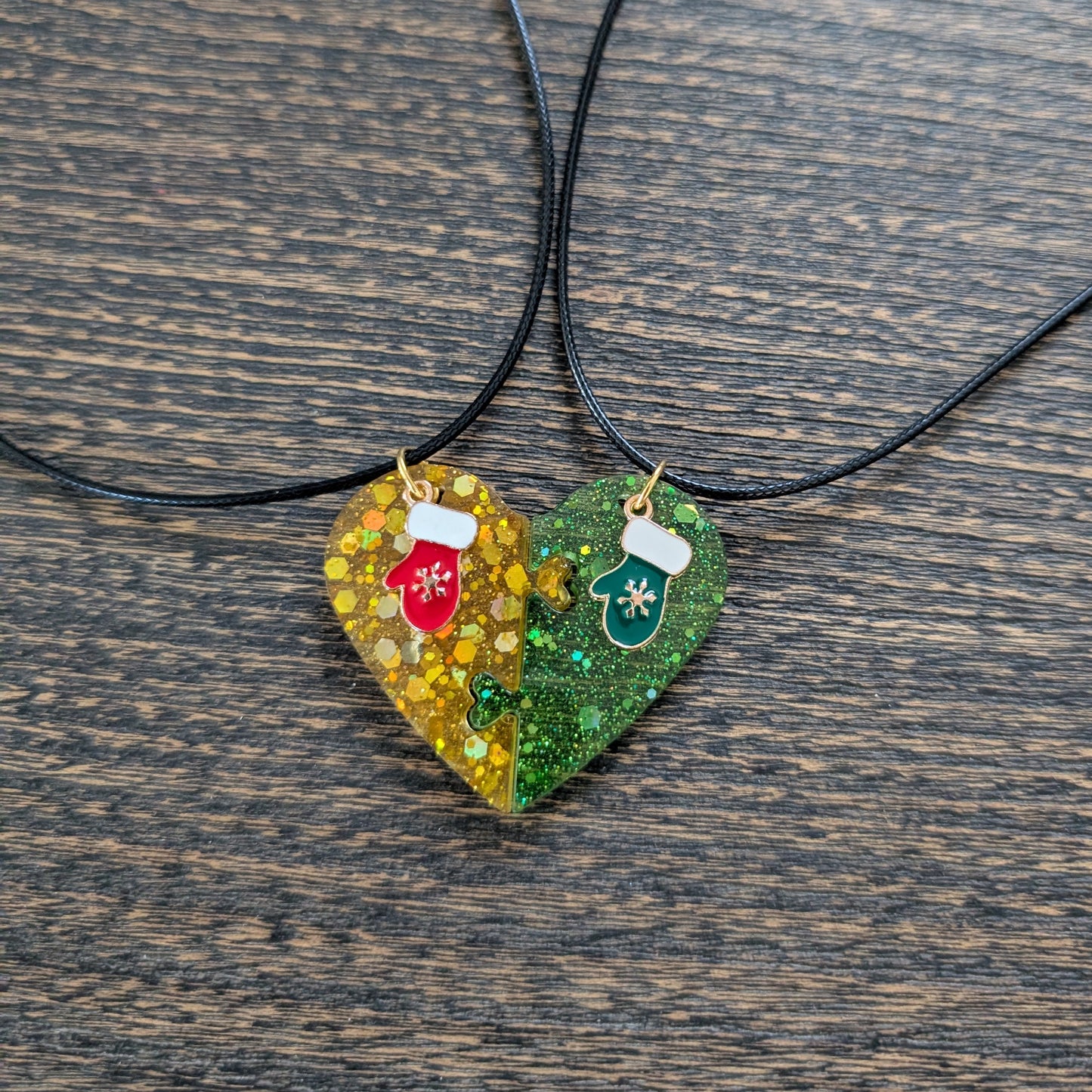 Necklace - 17.5 inches black waxed cord with two resin half hearts and a Christmas charm