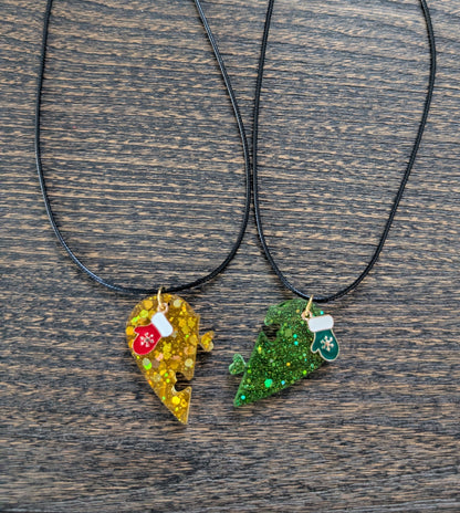 Necklace - 17.5 inches black waxed cord with two resin half hearts and a Christmas charm