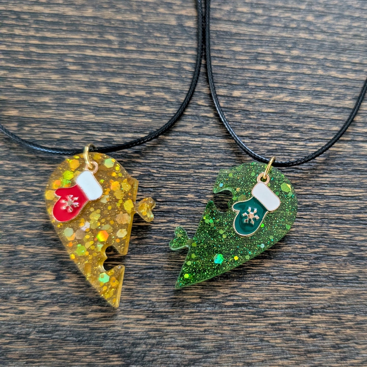 Necklace - 17.5 inches black waxed cord with two resin half hearts and a Christmas charm