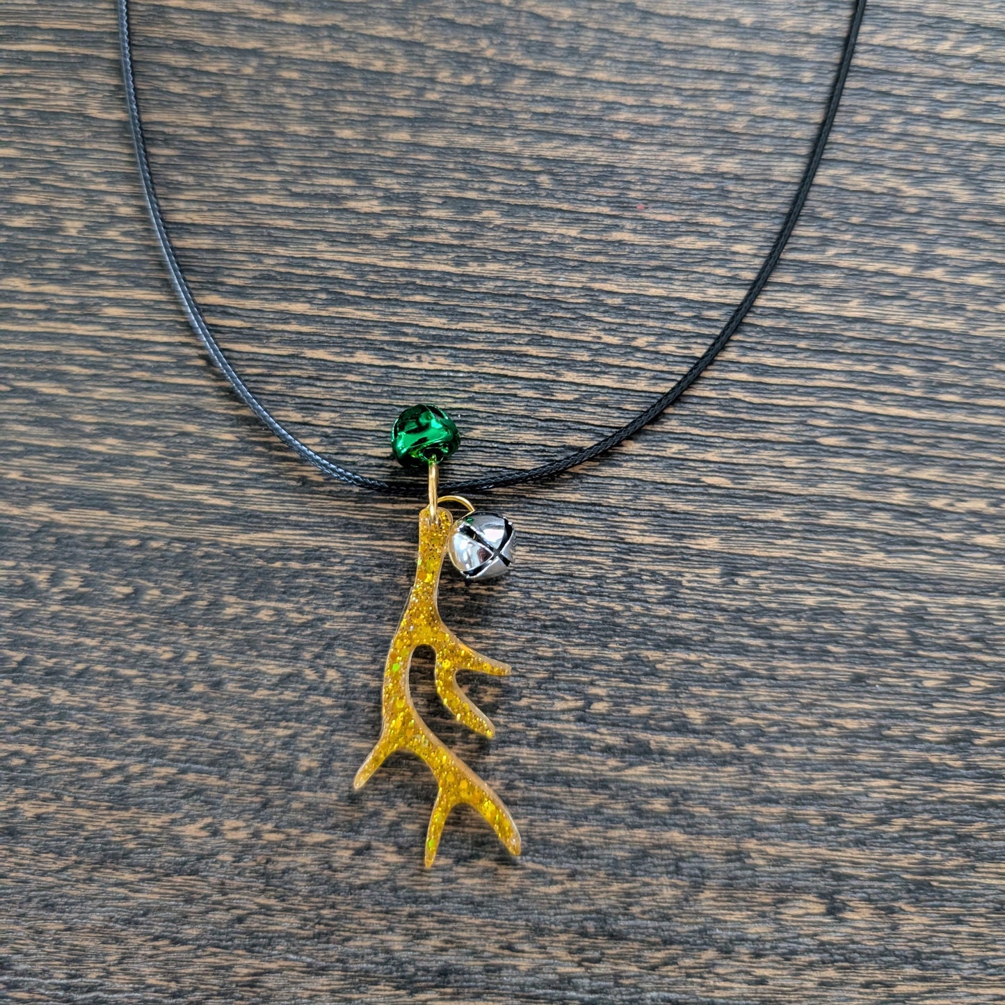Necklace - 17.5 inches black waxed cord with resin Christmas charm and jingle bells