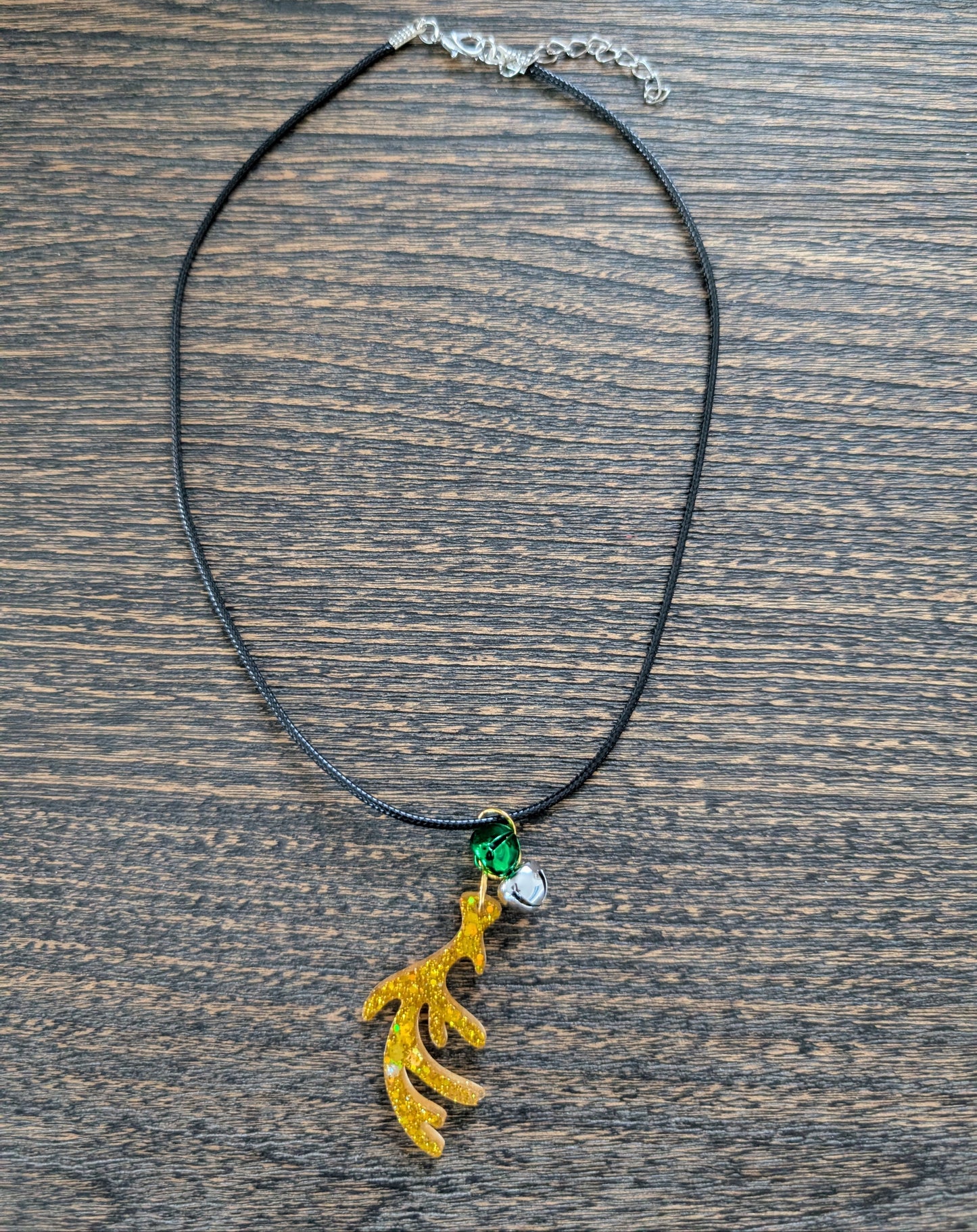 Necklace - 17.5 inches black waxed cord with resin Christmas charm and jingle bells
