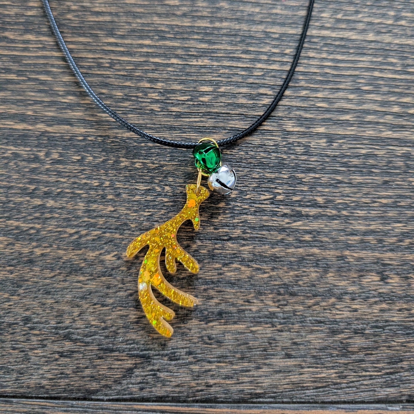 Necklace - 17.5 inches black waxed cord with resin Christmas charm and jingle bells