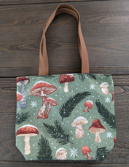 Snowy Mushrooms bag with orange lining one inner pocket and zipper closure