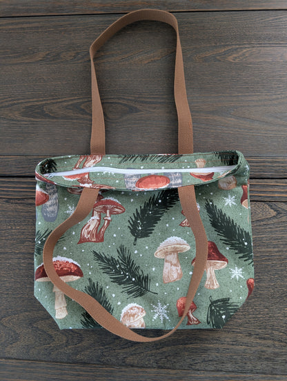 Snowy Mushrooms bag with orange lining one inner pocket and zipper closure