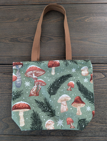 Snowy Mushrooms bag with orange lining one inner pocket and zipper closure