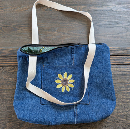 Jean tote bag with bees on green dots lining one outer pocket one inner pocket and zipper closure