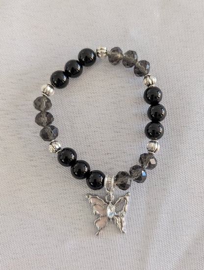 Bracelet - Elastic black beads with silver butterfly charm