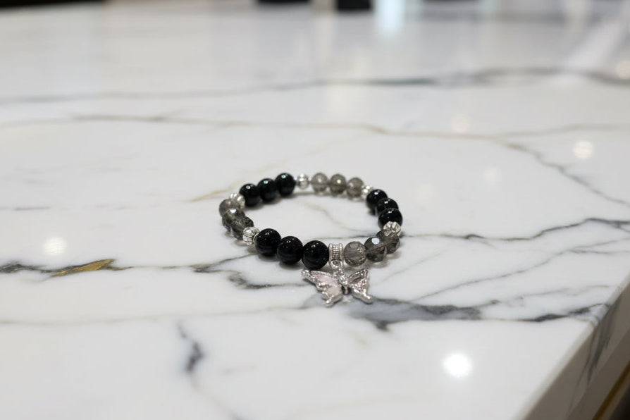 Bracelet - Elastic black beads with silver butterfly charm