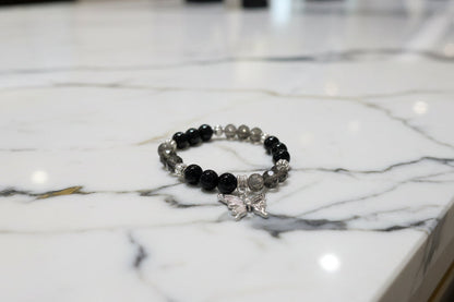 Bracelet - Elastic black beads with silver butterfly charm