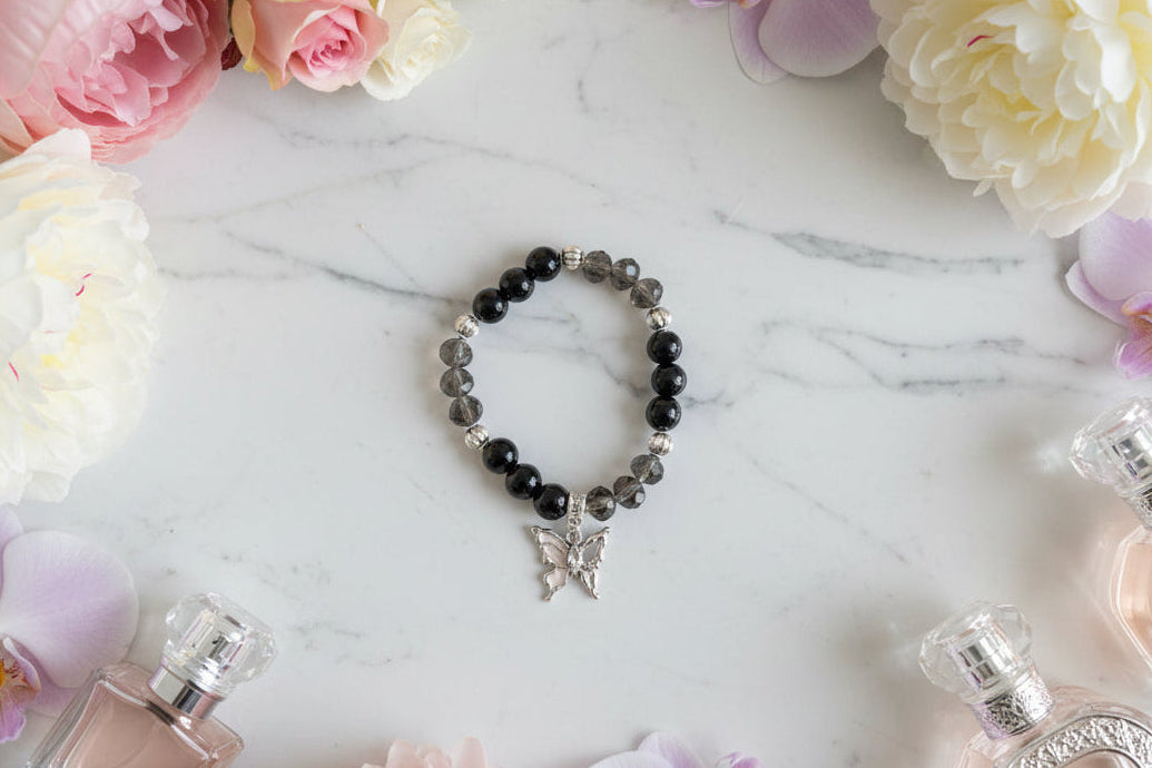 Bracelet - Elastic black beads with silver butterfly charm