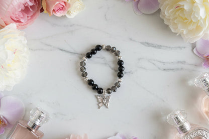 Bracelet - Elastic black beads with silver butterfly charm