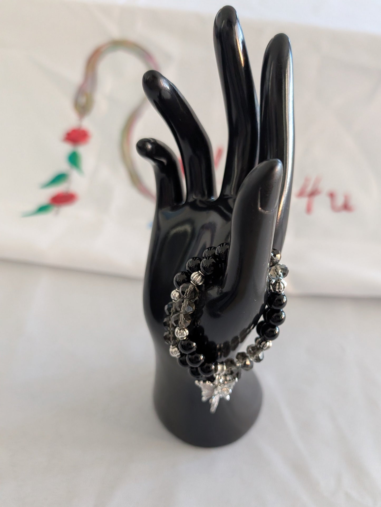 Bracelet - Elastic black beads with silver butterfly charm