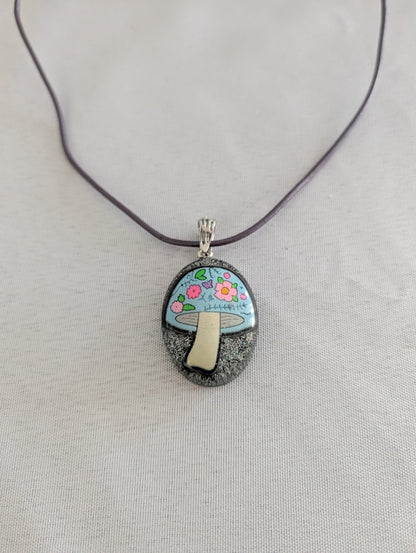 Pendant necklace with a mushroom design on a gray background